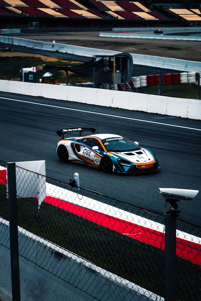 A McLaren car speeds around a race track in Catalonia, Spain.